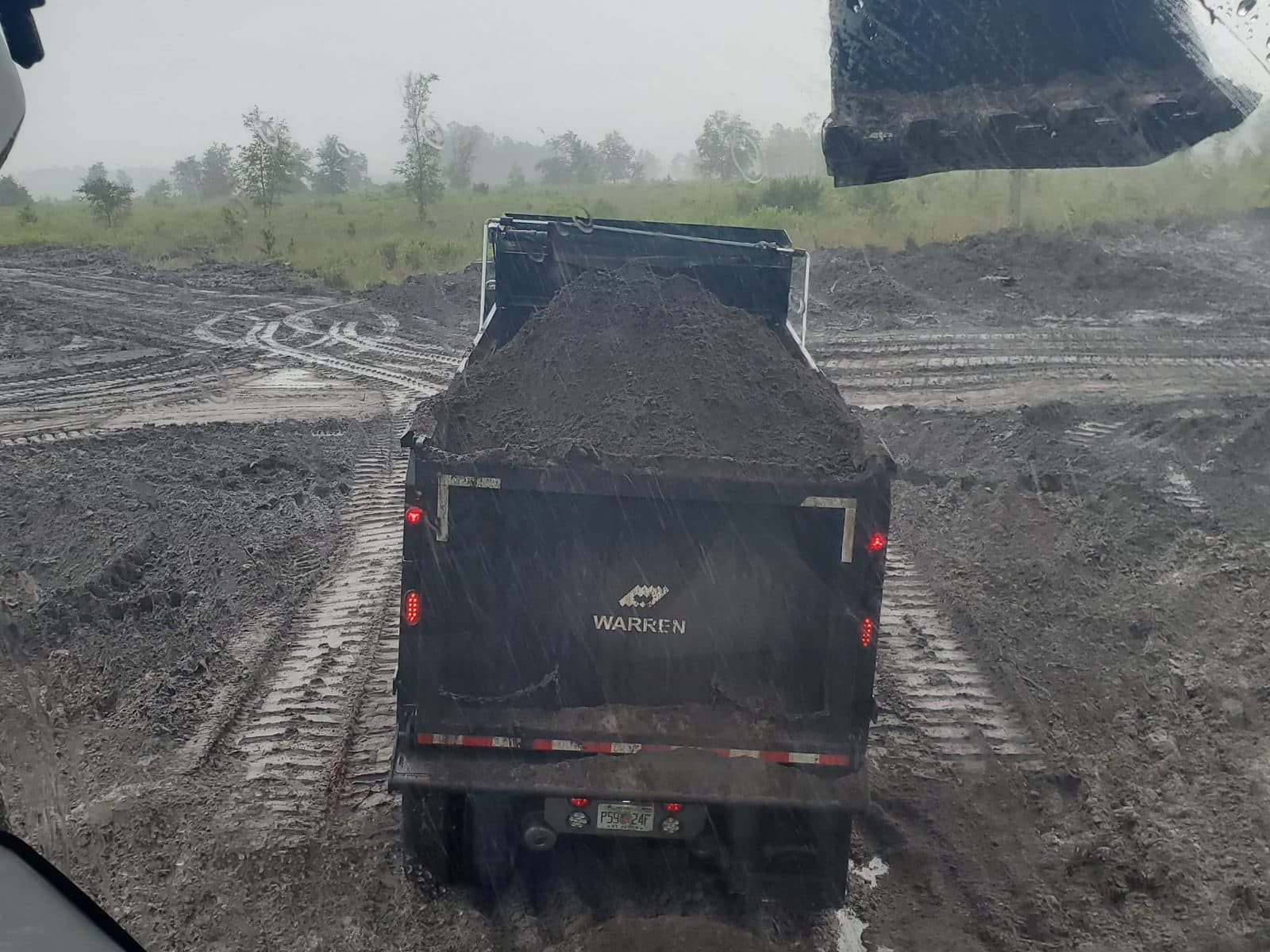 Dump truck loaded with fill dirt for delivery